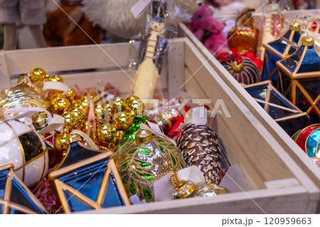 Christmas tree toys in wooden box atstore. New Year's sale Christmas tree toys in wooden box atstore. New Year's sale 120959663