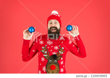 regular accessory. happy new year. merry christmas. resourceful and funny event manager juggler. happy man juggle christmas tree decorative toy. toy shop assistant. festive atmosphere is everywhere 120959905