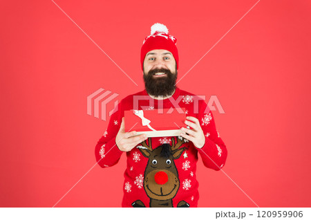 Merry christmas and happy new year. Christmas present concept. Buy thing from wish list. Christmas gift. Guy wear winter hat. Handsome man celebrate winter holidays red background. Christmas shopping Merry christmas and happy new year. Christmas present concept. Buy thing from wish list. Christmas gift. Guy wear winter hat. Handsome man celebrate winter holidays red background. Christmas shopping 120959906