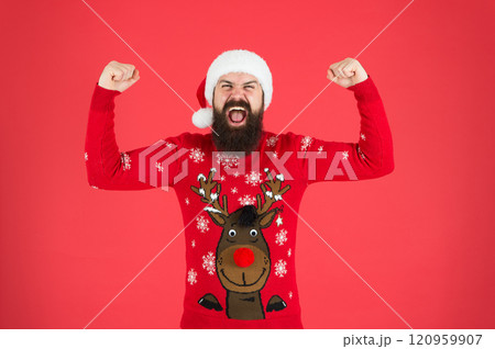 Add some sparkle to Christmas. happy new 2020 year. funny hipster knitted sweater. winter holiday celebration. feel joy and hapiness. bearded man red santa hat. christmas time. male at xmas party Add some sparkle to Christmas. happy new 2020 year. funny hipster knitted sweater. winter holiday celebration. feel joy and hapiness. bearded man red santa hat. christmas time. male at xmas party 120959907