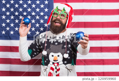 Spread joy. Winter greetings. Having fun. Cheerful hipster. Great american Christmas. Happy santa american flag background. Bearded american man. Celebrate Christmas and new year american way Spread joy. Winter greetings. Having fun. Cheerful hipster. Great american Christmas. Happy santa american flag background. Bearded american man. Celebrate Christmas and new year american way 120959960