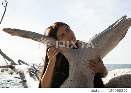 young brunette girl having fun on seacoast, lifestyle people concept close up young brunette girl having fun on seacoast, lifestyle people concept close up 120960291