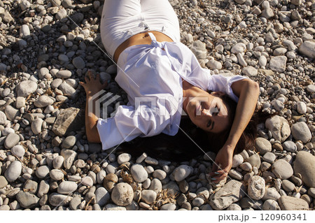 young brunette girl having fun on seacoast, lifestyle people concept close up 120960341