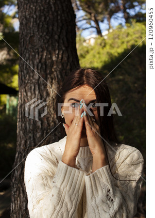 young brunette woman outside in green park sunny day, lifestyle people concept close up young brunette woman outside in green park sunny day, lifestyle people concept close up 120960455