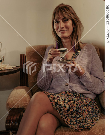 Woman Drinks Tea 120960590