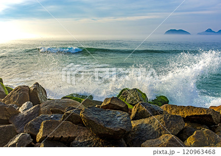 Waves crashing against breakwater Waves crashing against breakwater 120963468