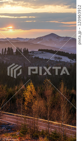 Picturesque sunrise above late autumn mountain countryside.  Ukraine, Carpathian Mountains. Peaceful traveling, seasonal, nature and countryside beauty concept scene. 120963912