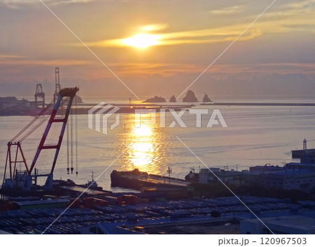 the industrial port cranes at sunrising 120967503
