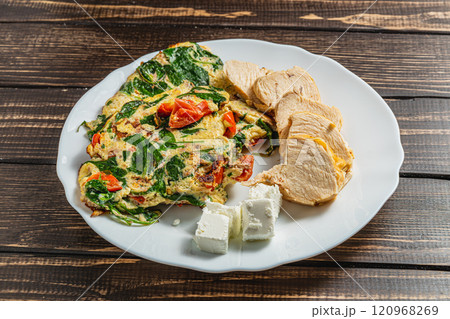 Healthy food, omelet with vegetables, chicken and feta cheese 120968269