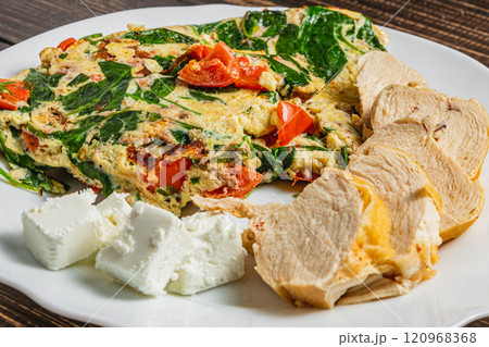 Healthy food, omelet with vegetables, chicken and feta cheese 120968368