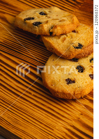 Festive homemade cookies with raisins on a wooden table Christmas concert 120968372