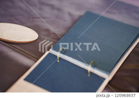 A notebook with black flip pages on the rings. A notebook with black flip pages on the rings. 120968637