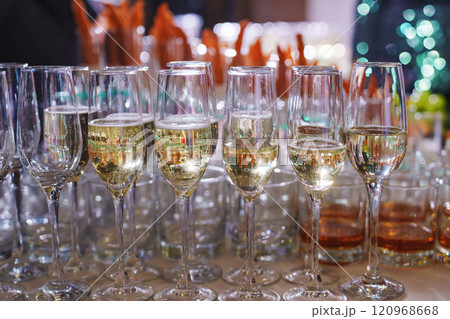 glasses of champagne on the buffet table against the background of appetizers. 120968668