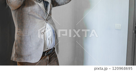 without a face. A small jacket does not fasten on a man's stomach. Overweight. 120968695