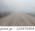 Dirt road in rural on a heavy foggy day 120970904