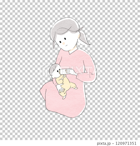 A woman sitting and feeding her baby 120971351