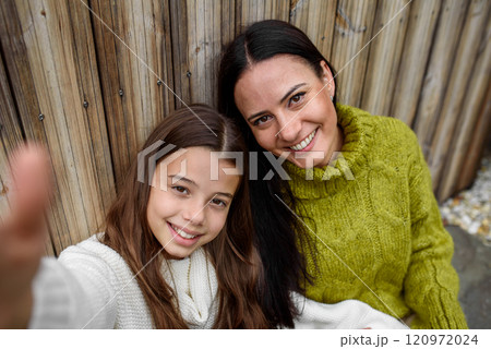 Selfie portrait of beautiful mother with young daughter. Selfie portrait of beautiful mother with young daughter. 120972024