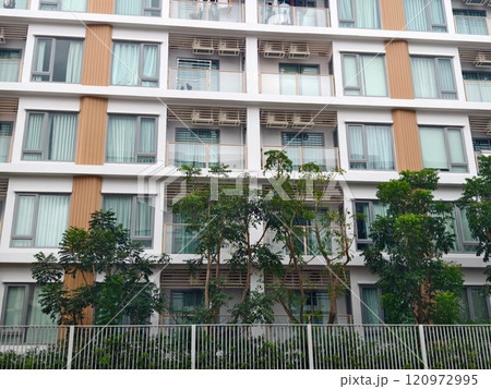 Detailed view of windows, doors and balconies of city buildings  120972995