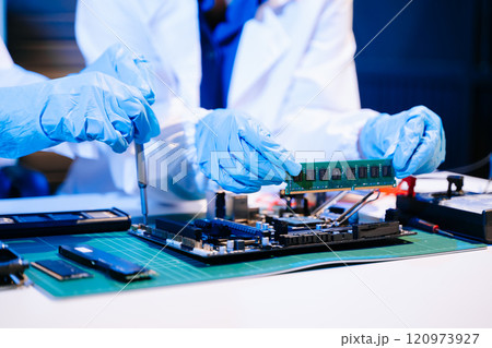 Electronics assembly and RAM installation with high-tech components. Ideal for showcasing advanced technology 120973927