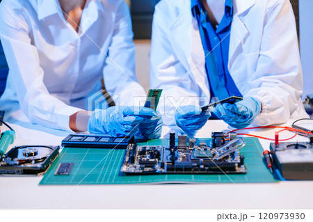 Electronics assembly and RAM installation with high-tech components. Ideal for showcasing advanced technology Electronics assembly and RAM installation with high-tech components. Ideal for showcasing advanced technology 120973930