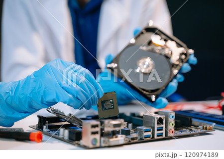 Technician repairing inside of hard disk drive by screwdriver. the concept of data, hardware, technician Technician repairing inside of hard disk drive by screwdriver. the concept of data, hardware, technician 120974189