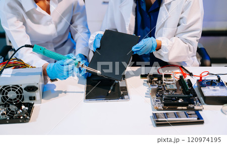 Electronics technician, electronic engineering electronic repair, electronics measuring and testing, repair and maintenance concepts.uses Electronics technician, electronic engineering electronic repair, electronics measuring and testing, repair and maintenance concepts.uses 120974195