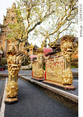 Golden Musical instrument in Ancient Pagoda of Portal von Taman Saraswati temple in Ubud city landmark on Bali Island of Indonesia. Travel destination for culture of Asian Golden Musical instrument in Ancient Pagoda of Portal von Taman Saraswati temple in Ubud city landmark on Bali Island of Indonesia. Travel destination for culture of Asian 120974335