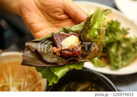 Korean barbecue food. Lettuce , Sesame leaf and meat wrap Korean barbecue food. Lettuce , Sesame leaf and meat wrap 120974833