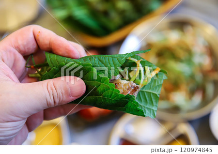 Korean barbecue food. Lettuce , Sesame leaf and meat wrap 120974845