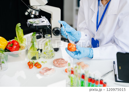 Food science as lab scientists test and analyze vegetables for safety and quality using advanced technology Food science as lab scientists test and analyze vegetables for safety and quality using advanced technology 120975015