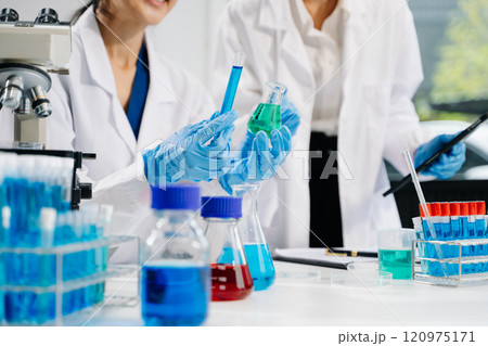 Modern medical research laboratory. female scientist hands working with micro pipettes analyzing biochemical samples, Modern medical research laboratory. female scientist hands working with micro pipettes analyzing biochemical samples, 120975171