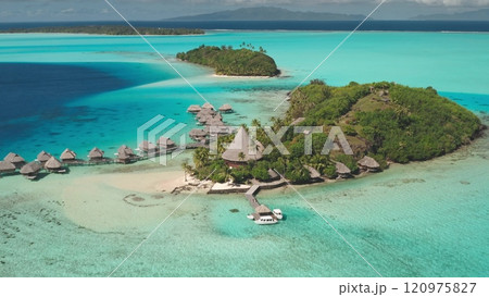 Breathtaking aerial view of overwater bungalows on Bora Bora island, French Polynesia. Crystal-clear turquoise waters coral reef lagoon. Exotic travel vacation, romantic honeymoon tourist destination Breathtaking aerial view of overwater bungalows on Bora Bora island, French Polynesia. Crystal-clear turquoise waters coral reef lagoon. Exotic travel vacation, romantic honeymoon tourist destination 120975827