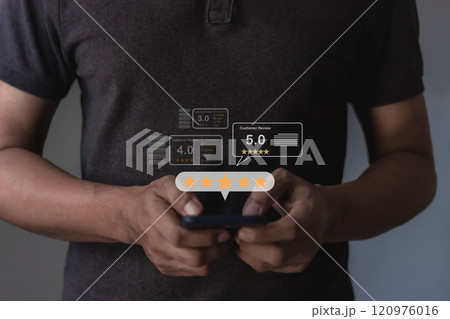 Customer Review, Young Man hand using smartphone mobile with five star to review and give 5 stars Customer Review, Young Man hand using smartphone mobile with five star to review and give 5 stars 120976016