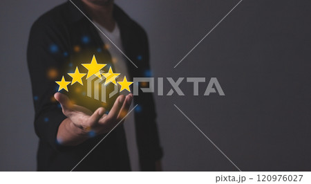 Customer Satisfaction, Young Man hand holding five star to review and give 5 stars 120976027