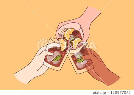Alcoholic drink in glasses in hands of people drinking whiskey with pieces of lime and ice cubes Alcoholic drink in glasses in hands of people drinking whiskey with pieces of lime and ice cubes 120977073