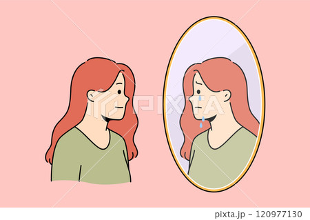 Bipolar disorder in woman smiling but feeling suffering in soul, and looking in mirror 120977130