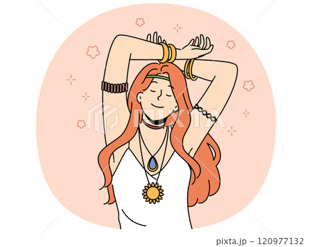 Hippie woman with amulet and bracelets on hands closes eyes, slowly dances with hands up 120977132