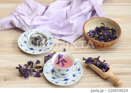 A cup of herbal tea from dried flowers of Wild mallow, lat. Malva sylvestris. A cup of herbal tea from dried flowers of Wild mallow, lat. Malva sylvestris. 120978029