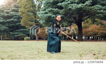 Nature, fight and Asian woman with bamboo sword in park for martial arts, Kendo practice and exercise. Culture, bokuto and person with shinai for skills, fitness and traditional training in Japan Nature, fight and Asian woman with bamboo sword in park for martial arts, Kendo practice and exercise. Culture, bokuto and person with shinai for skills, fitness and traditional training in Japan 120978666