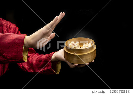 Chinese person showing dim sum dumpling on bamboo wooden basket bowl 120978818