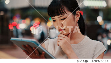 Japanese woman, city street and tablet with thinking in planning, property and industry as architect. Female person, tech and night with ideas, investment and opportunity for real estate development 120978853