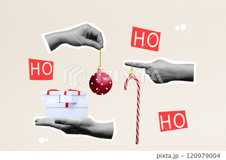 Human hand holding candy cane, christmas ball and gift box with ho-ho-ho text like santa claus on colored background 120979004