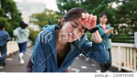 Fatigue, break and woman outdoor with running for health, wellness and marathon training in city. Tired, sweating and Japanese female athlete with exhaustion for cardio exercise or workout in town. 120979108
