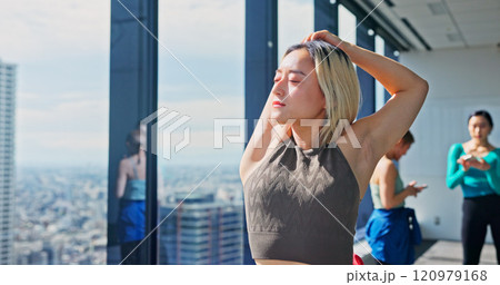 Warm up, Japanese woman and stretching for practice, training and choreography in ballet dance studio. Fitness, arm muscle flexibility and dancer for company, theater and performance art school 120979168