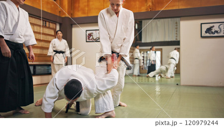 Karate, martial arts and submission with students in dojo for demonstration, fitness or training. Challenge, self defense or technique with teacher and people in Japan for combat, fighting or sports 120979244