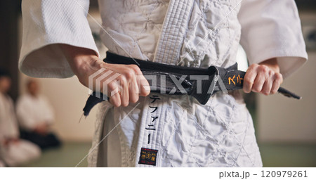 Person, hands and black belt for karate with exercise, ready and prepare for training in Japan studio. Man, martial arts or professional fighter in dojo for sport, expertise or sensei in self defense Person, hands and black belt for karate with exercise, ready and prepare for training in Japan studio. Man, martial arts or professional fighter in dojo for sport, expertise or sensei in self defense 120979261