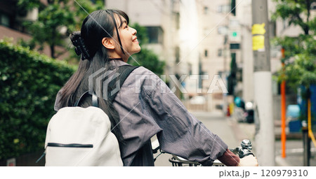 Travel, explore and Asian woman with bicycle in city for morning commute, adventure and journey. Sightseeing, cycling and person on bike for trip, sustainable and eco friendly transport in Japan 120979310