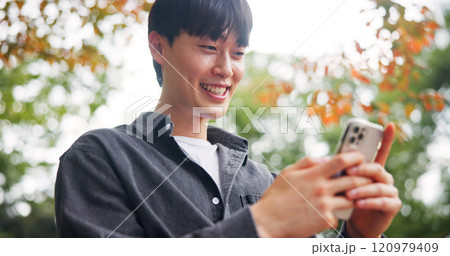 Smile, man and relax with phone at park for travel guide, communication and location directions. Happy, person and mobile for contact, abroad chat and vacation information of morning commute in Japan Smile, man and relax with phone at park for travel guide, communication and location directions. Happy, person and mobile for contact, abroad chat and vacation information of morning commute in Japan 120979409