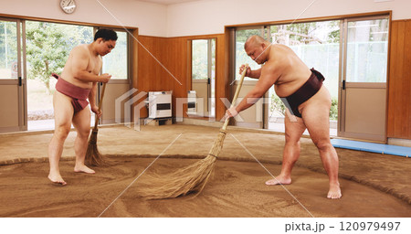 Broom, dohyo and sand of Sumo wrestler people in mawashi, getting ready for competition. Cleaning, preparation and start with Japanese men for culture, local heritage or martial arts tradition Broom, dohyo and sand of Sumo wrestler people in mawashi, getting ready for competition. Cleaning, preparation and start with Japanese men for culture, local heritage or martial arts tradition 120979497