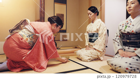 Tea room, hostess and serving ceremony with women, wellness and traditional kimono for culture. Chawan, guests and bowl with cultural outfit for matcha drink, process and respect for home hospitality Tea room, hostess and serving ceremony with women, wellness and traditional kimono for culture. Chawan, guests and bowl with cultural outfit for matcha drink, process and respect for home hospitality 120979728